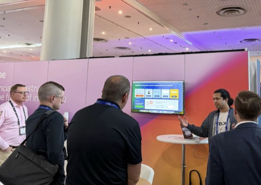 Fletch team demoing at a conference booth